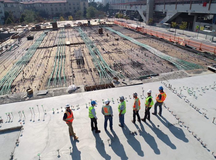 Construction workers and engineers on a building site